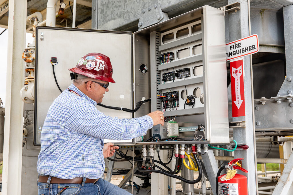 Man configuring complex burner management system