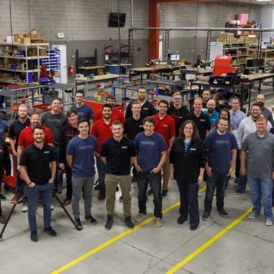 Profire Energy team members gathered for a group photo inside the company manufacturing and assembly facility