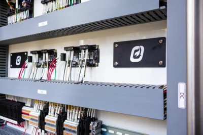 Close-up of wired control modules and terminal blocks inside a Profire control cabinet.