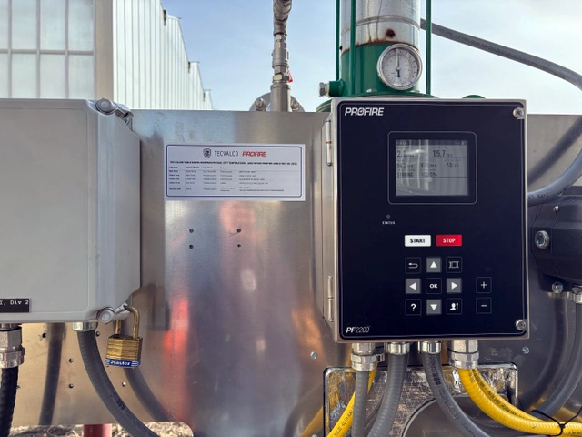 Profire PF2200 burner management controller mounted beside an electrical enclosure and Tecvalco equipment label.
