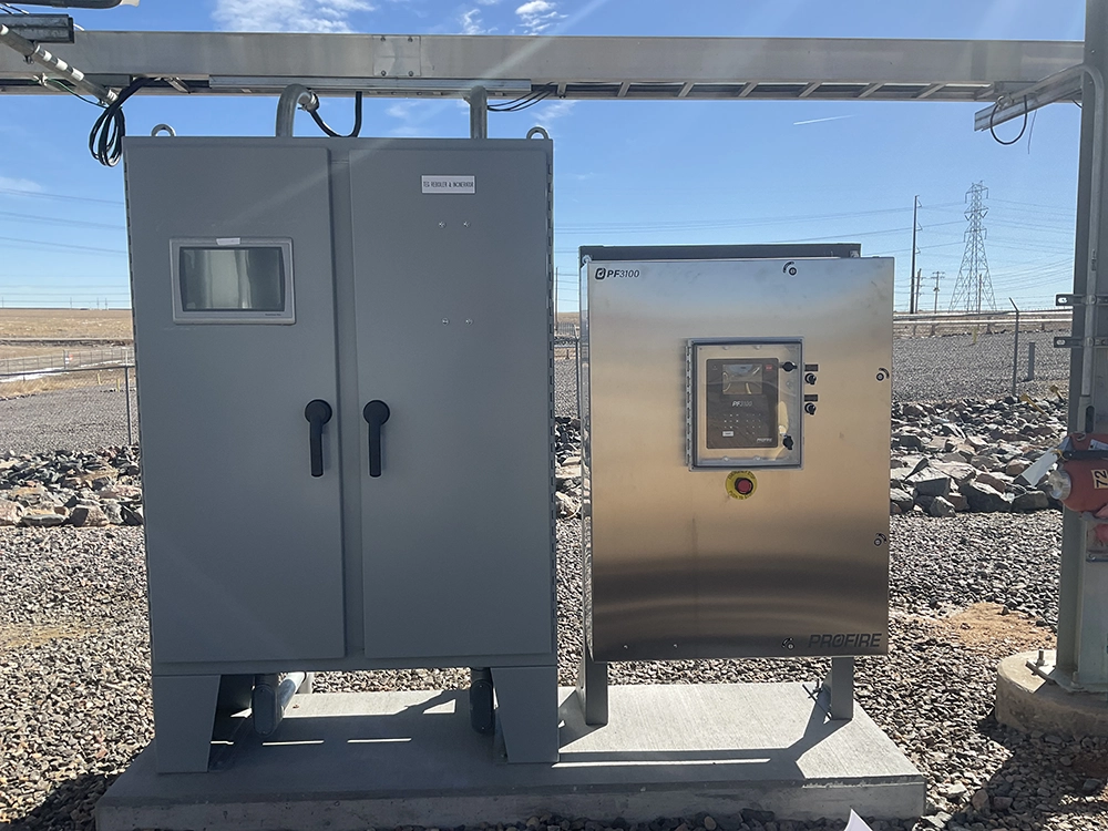 Profire PF3100 burner management panel installed beside the main reboiler and incinerator control enclosure.
